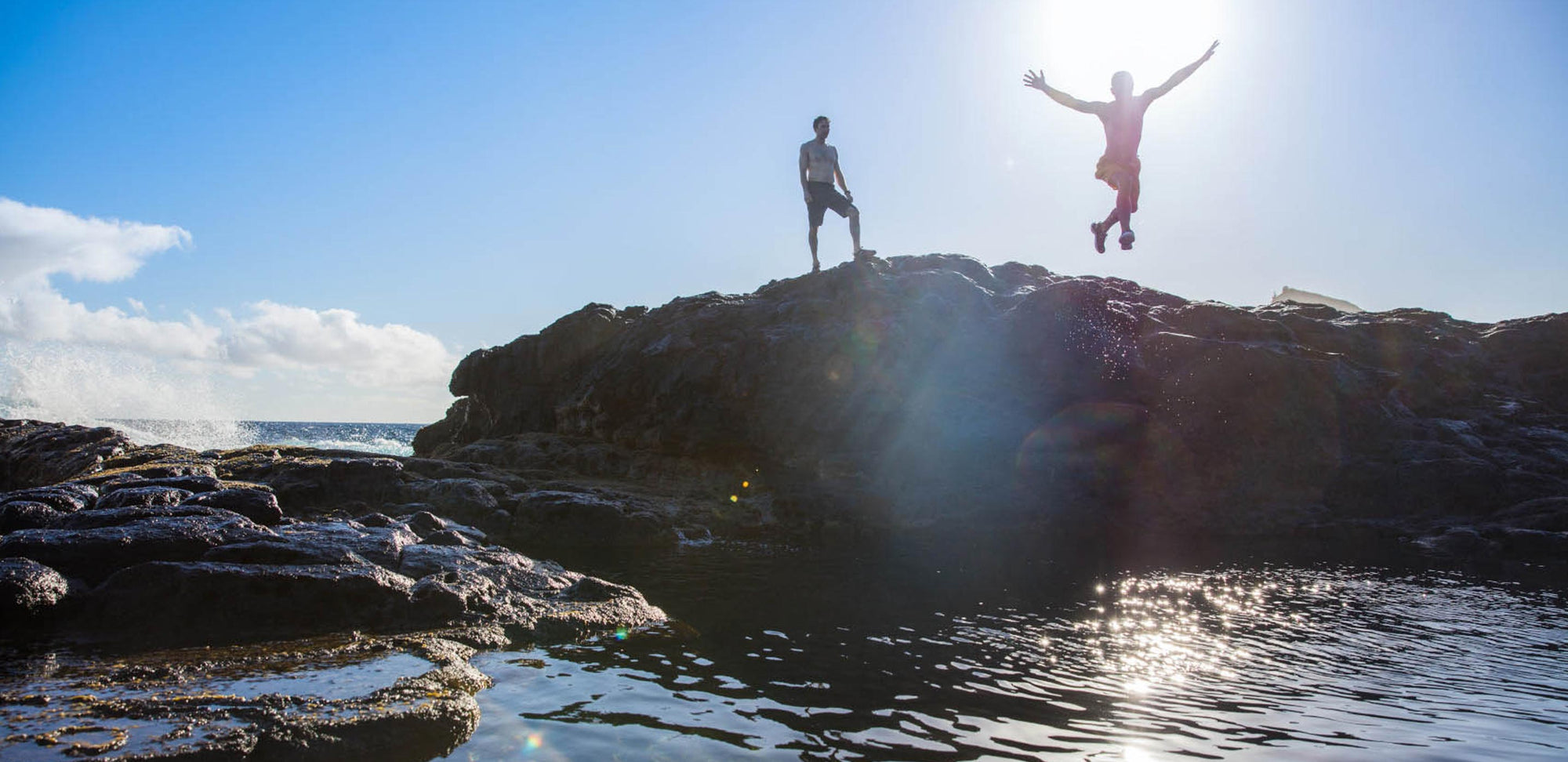 Jumping into a deep tidal pool in Maui in KEEN water sandals