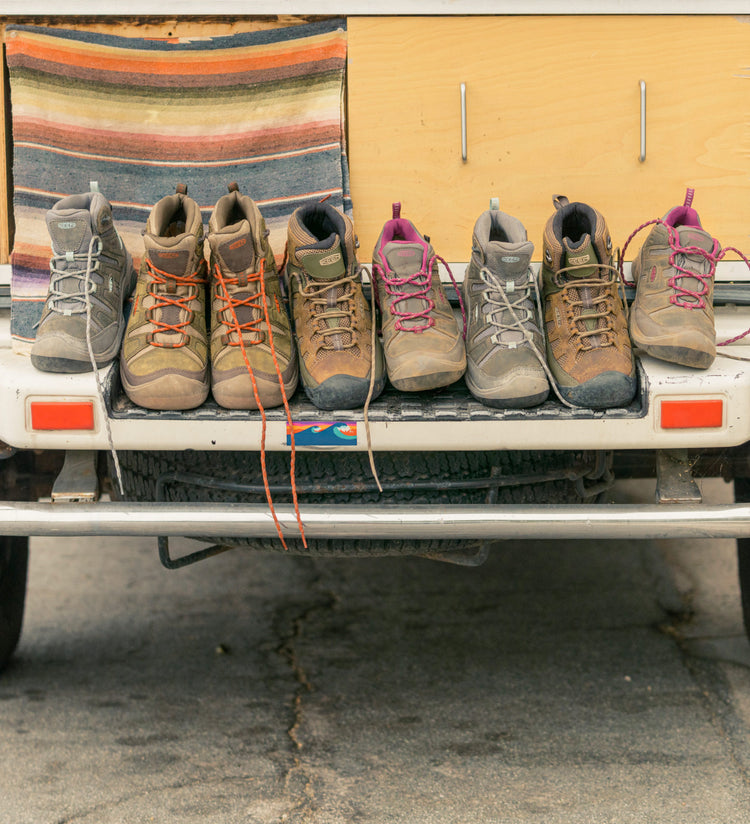 Assorted Targhee boots spread out on the back of the car